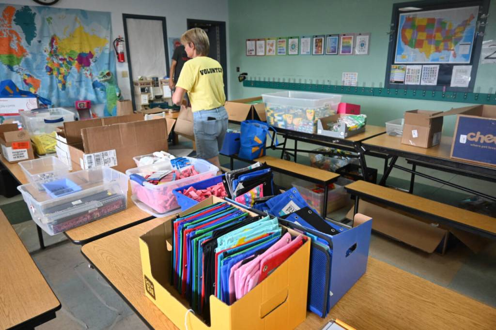 Sequim Gazette photo by Michael Dashiell / Kim Rosales and other volunteers help gather school supplies for local students at the 2023 Back to School Fair, held at the Sequim Boys & Girls Club on Aug. 26.