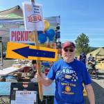 Photo courtesy of Sequim Noon Rotary / Sequim Noon Rotarian Henry Jones directs traffic at the Unity of Effort event on Aug. 12.