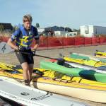 File photo by Keith Thorpe/Olympic Peninsula News Group / Ian Mackie of Gig Harbor prepares to launch his kayak from Pebble Beach as an iron man competitor during the Big Hurt in Port Angeles in 2022.