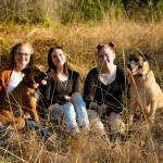 Photo courtesy Rachael Healey
Rachael Healey, on left, and her two daughters, Kaitlyn, 18, middle, and Kenzie, 16, right, lost their Dungeness home and two dogs Stella, front left, and Ollie, in a fire on Aug. 23. The family seeks a new place to rent as they live in a hotel while continuing to work and go to school.