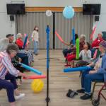 Sequim Gazette file photo by Emily Matthiessen / Volunteers and people living with memory loss play a variation of balloon volleyball during a Tims Place gathering at Trinity United Methodist Church in 2022. The group hosts an online auction fundraiser from Sept. 21-28.