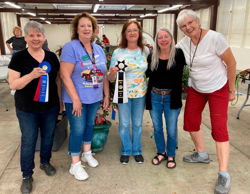 Photo courtesy Sequim Prairie Garden Club/ Celebrating the Floral Barns win for Best Barn at the Clallam County Fair, are, from left, Joan Whiting with the Sequim Prairie Garden Club; Tina Cozzolino, floral barn superintendent; Della LaCour with the Garden Club; Ellen Castleman with the Garden Club, and Patricia Wheatly, assistant floral barn superintendent.