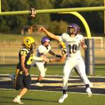 Sequim Gazette photo by Michael Dashiell / Sequim quarterback Lars Wiker looks for an open receiver deep in Wolves territory in the first half of SHS's season-opener at Forks on Sept. 1. Wiker completed the pass to Zeke Schmadeke, and later found younger brother Liam for a pair of touchdowns as Sequim built a 14-0 lead by halftime.