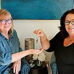 Photo courtesy Sequim Irrigation Festival
Vickie Maples, left, accepts the ceremonial keys to the Sequim Irrigation Festival from Deon Kapetan as Maples becomes the new executive director for the festival going into its 129th year. Kapetan has served in various volunteer roles since 1999 including as executive director.