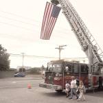 Sequim Gazette photo by Matthew Nash
A fire truck on Fifth Avenue displays an American flag on the 22nd anniversary of the 9/11 terrorist attacks.