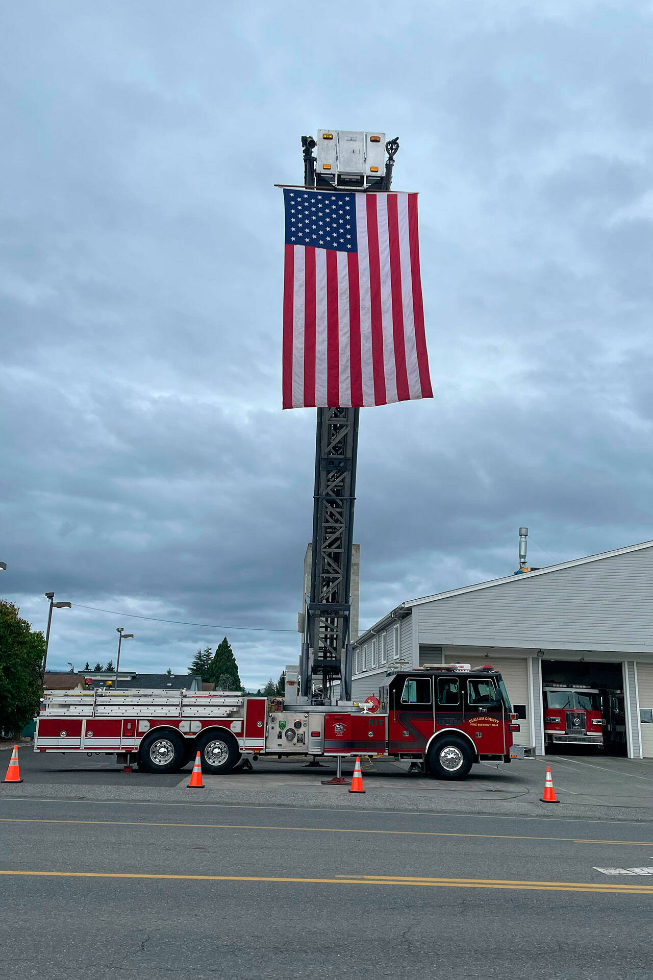 Sequim Gazette photo by Matthew Nash
A fire truck on Fifth Avenue displays an American flag on the 22nd anniversary of the 9/11 terrorist attacks.