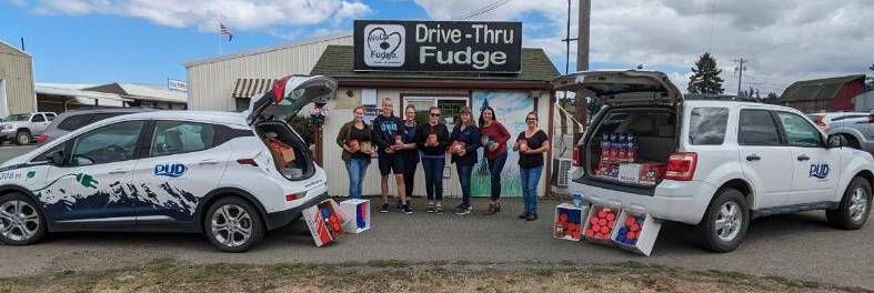 Photo courtesy of WeDo Fudge
Employees/staff with WeDo Fudge, Cascade Caramel and Clallam County Public Utility District No. 1 gather more than 450 pounds of peanut butter at their annual drive to donate to the Sequim Food Bank.