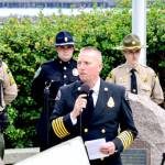 Port Angeles Fire Department Chief Derrell Sharp gives remarks at a ceremony commemorating the first responders who died in the Sept. 11, 2001, terrorist attacks at the 9/11 Memorial Waterfront Park in Port Angeles on Monday. (Peter Segall/Peninsula Daily News)