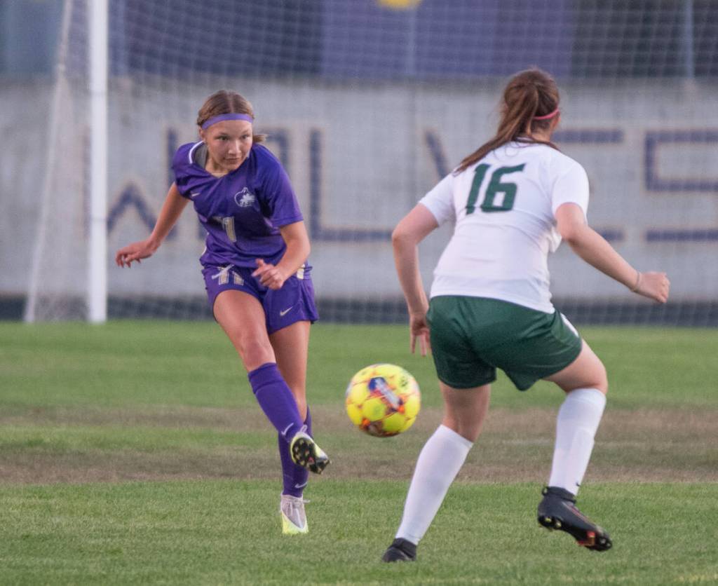 Sequim Gazette photo by Emily Matthiessen / Sequim's xxxxxxx, left, looks for an open teammate as Port Angeles' 16 defends in SHS's 2-1 home win on Dept. 14.