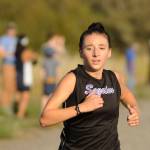 Sequim Gazette photo by Michael Dashiell / Sequim High senior Kaitlyn Bloomenrader races to a fourth place finish at an Olympic League cross country meet in Sequim on Sept. 20.