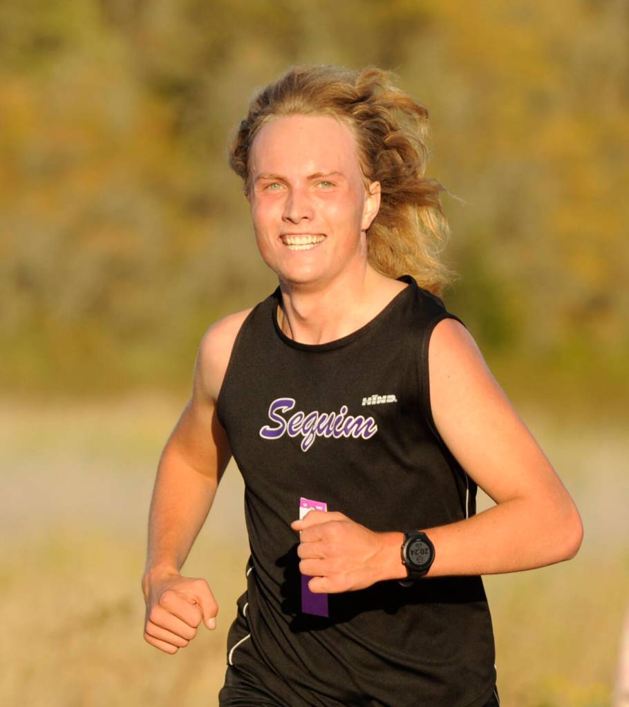 Sequim Gazette photo by Michael Dashiell / Sequims Solas McGruther races in an Olympic League cross country meet in Sequim on Sept. 20. McGruther was the top Wolf in the competition, finishing in xxxx place.