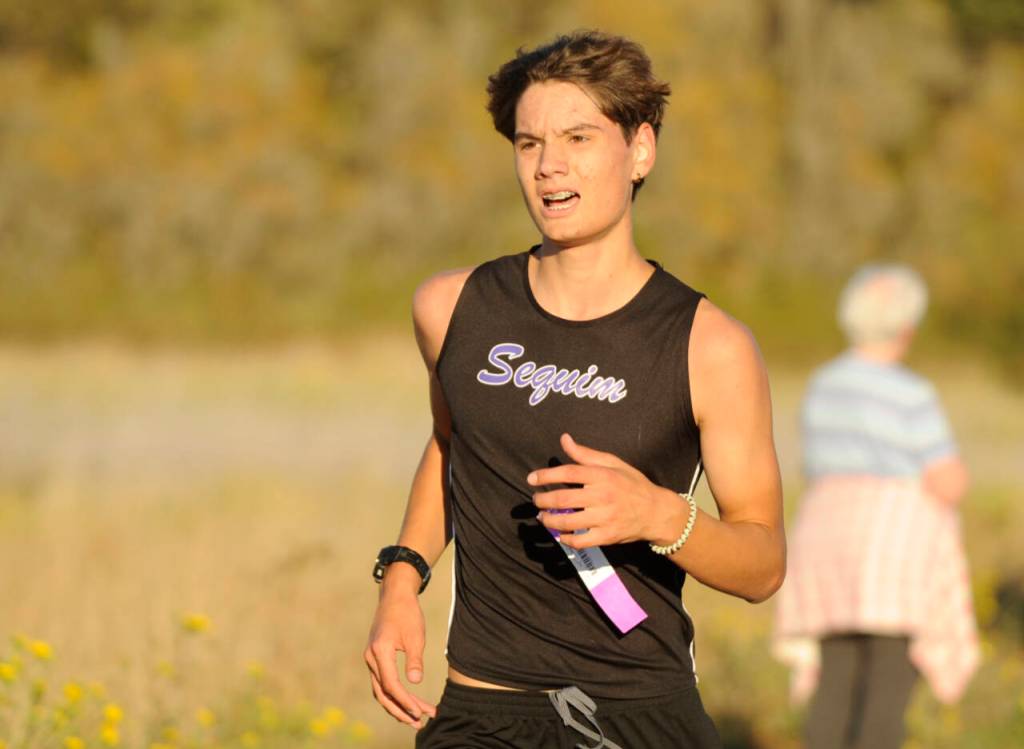 Sequim Gazette photo by Michael Dashiell / Sequims Malachi Byrne races in an Olympic League cross country meet in Sequim on Sept. 20.