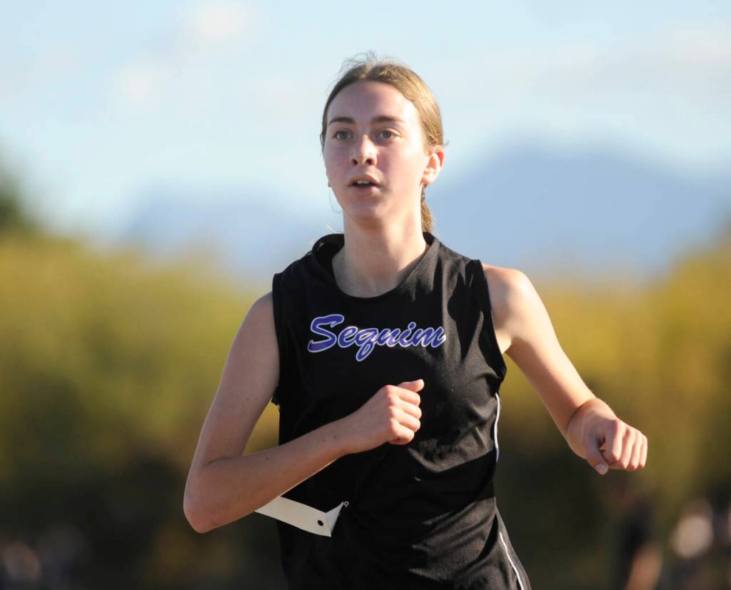 Sequim Gazette photo by Michael Dashiell / Sequims Lilly Despain races in an Olympic League cross country meet in Sequim on Sept. 20.