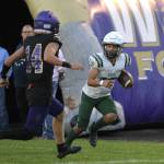 Sequim Gazette photo by Michael Dashiell / Port Angeles Kason Albough, right, evades the tackle of Sequims Zeke Schmadeke to score the Roughriders first touchdown in a 37-10 Rainshadow Rumble victory in Sequim on Sept. 22.