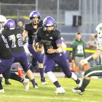 Sequim Gazette photo by Michael Dashiell
Sequim quarterback Lars Wiker (10) looks for running room against Port Angeles on Friday night.