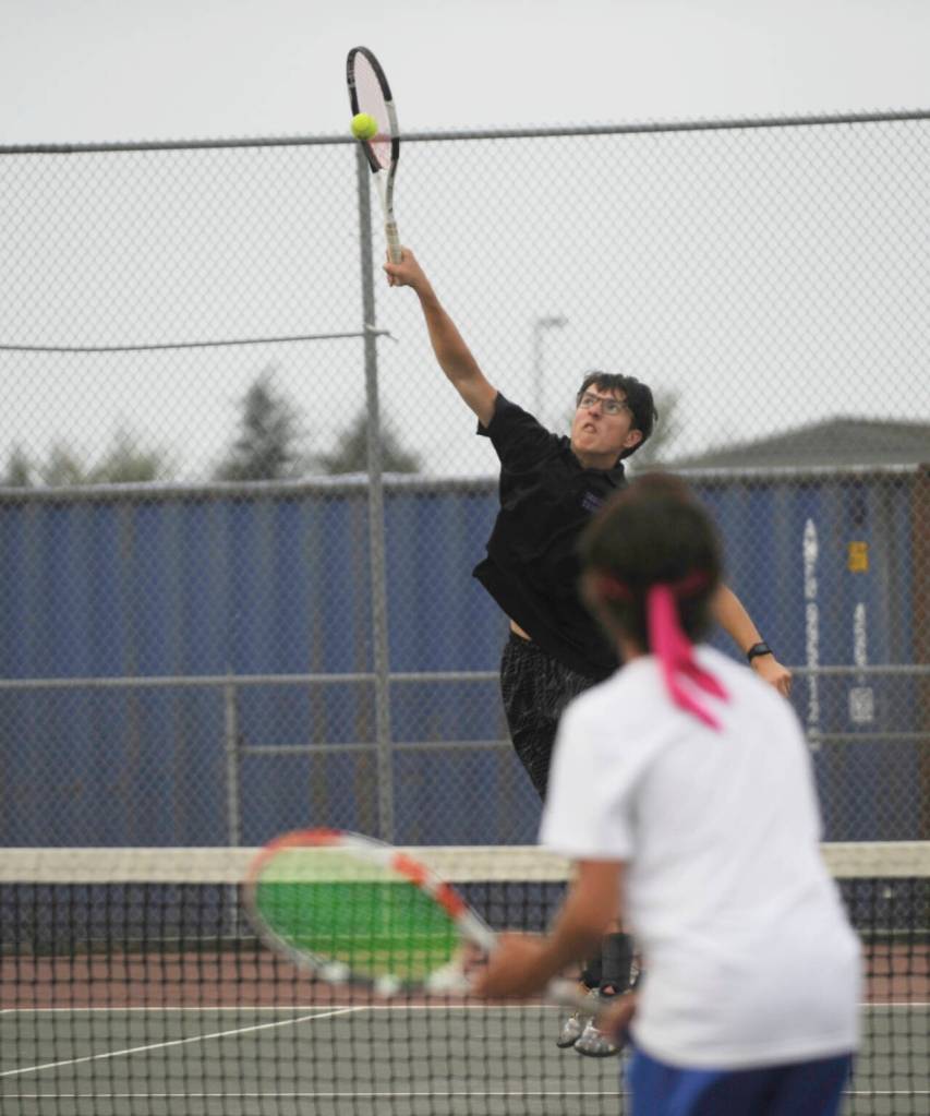 Sequim Gazette photo by Michael Dashiell / Sequims William Hughes looks for an overhead winner as he and teammate Tom Laschet take on Olympics Colby Andrews and Dew Walter on Sept. 19.