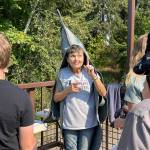 Sequim Gazette photo by Matthew Nash/ At the Dungeness River Festival, volunteer Connie Barron speaks to school children about the different salmon species and how to keep the river healthy.