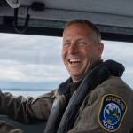 Sequim Gazette photo by Emily Matthiessen / Sergeant Matt Jewett, Region 6 WDFW, steers the boat on a beautiful overcast day in late summer.