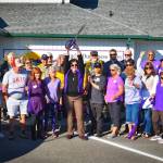 Photo courtesy Monica Berkseth
Beth Pratt, executive director of the Sequim-Dungeness Valley Chamber of Commerce, celebrates cutting a ribbon on Sept. 21 after recent touch-ups at the facility, including new paint, signage, and repairs.