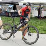 Photo by Keith Thorpe/Olympic Peninsula News Group / Calvin Colander of Bellingham-based Team Improbability Drive heads for the handoff after finishing the mountain bike leg of the Big Hurt in Port Angeles on Sept. 23.