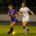 Sequims Kaia Lestage, left, battles with Bainbridges Elizabeth Stuyvesant in the first half of a Sept. 26 Olympic League showdown.