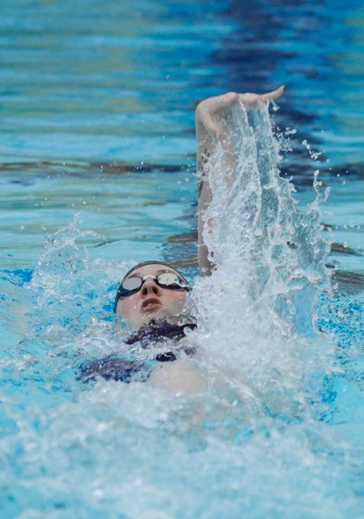 Sequims Natalie Cross competes in the 100 backstroke in an Olympic League meet against Bremerton on Sept. 27. Cross took first place, finishing in 1:18.54.