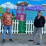 Sequim Gazette photo by Matthew Nash
Artist Craig Robinson stands by a mural he painted at the Sequim Habitat Boutique Store in downtown Sequim in collaboration with his wife and Habitats chief executive officer Colleen Robinson. They said an angel wing mural has gotten a good response so far, too.