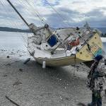 Sequim Gazette photo by Matthew Nash/ Pat Spradling Jr.s boat Dire Straits was pulled from the beach near John Wayne Marina on Sept. 29. Hes had the boat a few years, he said, and hopes to go sailing more often.