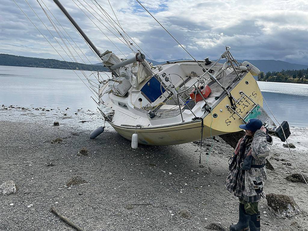 Sequim Gazette photo by Matthew Nash/ Pat Spradling Jr.s boat Dire Straits was pulled from the beach near John Wayne Marina on Sept. 29. Hes had the boat a few years, he said, and hopes to go sailing more often.