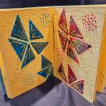 Photo courtesy of Jean Wyatt / Stitched Flower Bouquet Pages by Jean Wyatt, a participant in the Spinning Sewn Stories – Promulgate, Piece, & Ply exhibit hosted by the North Olympic Fiber Arts Festival.