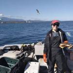 Photo courtesy of Coville Fish Company / Jenny Taylor is pictured on Johnny Utah, Coville Fish Companys Washington-based crabbing vessel, during a crabbing season.