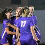 Sequim Gazette photo by Michael Dashiell / Sequim teammates celebrate their first goal scored by Jennyfer Gomez (second from left), as the Wolves take on Kingston at home on Oct. 3. The Wolves won, 4-0.