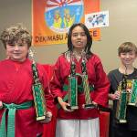 Sequim Gazette photo by Matthew Nash
Three students with Sequim Martial Arts, 235 E Washington St., Sequim, competed at the Tacoma City Classic Karate Tournament on Sept. 30. Local participants included, from left, Welcome Chapman, who won first place in Traditional Weapons, Khloe Schmidt who won second place both in Traditional Weapons and Traditional Empty Hand Forms, and Landen Parrish who won first place in Traditional Empty Hand Forms, second place in Traditional Weapons and third place in Creative Weapons.