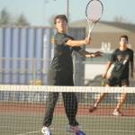 Sequim Gazette photo by Michael Dashiell / Sequims William Hughes, left, and Tom Laschet take on a Kingston team in No. 1 doubles play on Oct. 5 in Sequim.