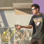 Sequim Gazette photo by Michael Dashiell / Sequims Tom Laschet returns a volley as he and doubles partner William Hughes take on a Kingston team in No. 1 doubles play on Oct. 5 in Sequim.