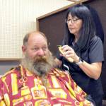 Photo by Keith Thorpe/Olympic Peninsula Daily News Group
U.S. Navy veteran Brent Brant of Port Hadlock gets a haircut from Susan Gile, owner of Bennys Barbershop in Sequim, during the Port Angeles Stand Down at the Clallam County Fairgrounds on Oct. 5. The event provides services and connect veterans to a variety of assistance organizations, as well as offer clothing, medical services and a meal.