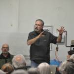 Sequim Gazette photo by Matthew Nash/ Fire commissioner Mike Mingee with Clallam County Fire District 3 tells a crowd of more than 30 people on Oct. 9 that no decision has been made to sell Lost Mountain Station 36. He and other fire commissioners agreed that they wanted to see a volunteer firefighter recruiting effort before making a decision on the station.