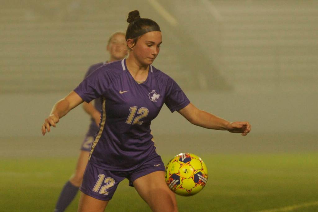 Sequim Gazette photo by Michael Dashiell / Sequims Olive Bridge looks for an open teammate in the first half of a 1-0 win over Olympic on Oct. 12.