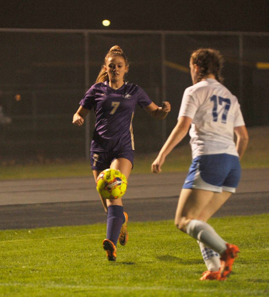 Sequim Gazette photo by Michael Dashiell / Sequims Eve Breithaupt, left, looks to get past Olympics Kaylee Cushman in the first half of a an Oct. 12 league match-up in Sequim.