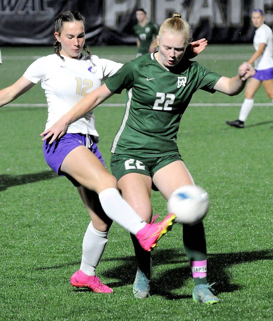 Photo by Keith Thorpe/Olympic Peninsula News Group / Sequims Olive Bridge, left, gets the ball away from Port Angele Paige Mason during an Olympic League at Peninsula College in Port Angeles on Oct. 10.