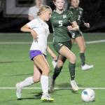 Photo by Keith Thorpe/Olympic Peninsula News Group / Sequims Ivy Barrett, front, dribbles past Port Angeles Kedryn DeScala during an Oct. 10 at Peninsula College.