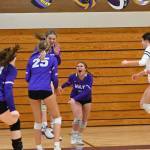 Sequim Gazette photo by Michael Dashiell / From left, Sequims Brianna Palenik, Jolene Vaara (25), Sydney Clark, Ashton Reichner, Tiffany Lam and Kassi Montero celebrate a key point in the third set of a three-set sweep of Port Angeles on Oct. 10.