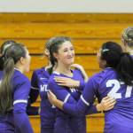 Sequim Gazette photoS by Michael Dashiell
Sequim teammates congratulate Rose Gibson, center, after scoring a point in the third set of an Oct. 10 sweep of Port Angeles.