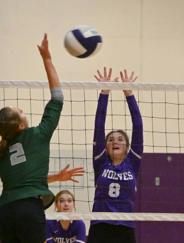 Sequim Gazette photo by Michael Dashiell / Sequims Rose Gibson, right, looks to block a volley by Port Angeles Mary Halberg in an Oct. 10 Olympic League match.