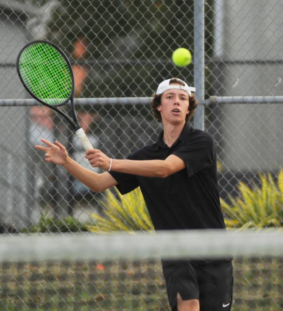 Sequims Garrett Little returns a volley as he takes on Port Angeles C.J. Elliott on Oct. 11 in Sequim. Little won the match and improved his season record to 12-0 later in the week.