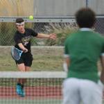 Sequim Gazette photos by Michael Dashiell
Sequims Lincoln Bear, left, returns a volley as he takes on Port Angeles Carter Gunderson on Oct. 11 in Sequim. Bear won a 7-6 (7-2) first set tiebreaker and went on to win the match. He went 2-0 in singles play last week.