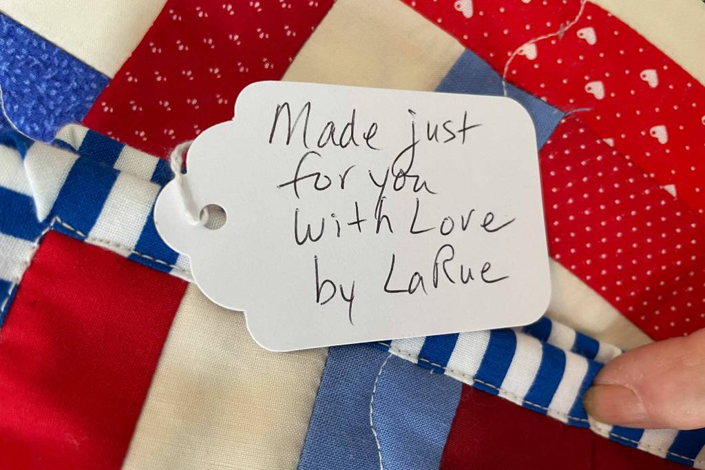 Sequim Gazette photo by Matthew Nash/ Each quilt from Project Linus quilters includes a personal note, such as this one from LaRue Robirts of Sequim.