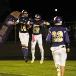 Sequims Zeke Schmadeke (14), Adrian Aragon (28) and Patrick Elias celebrate a 36-0 thumping of North Mason at Sequim Highs Homecoming game on Oct. 13. See story, B-2.