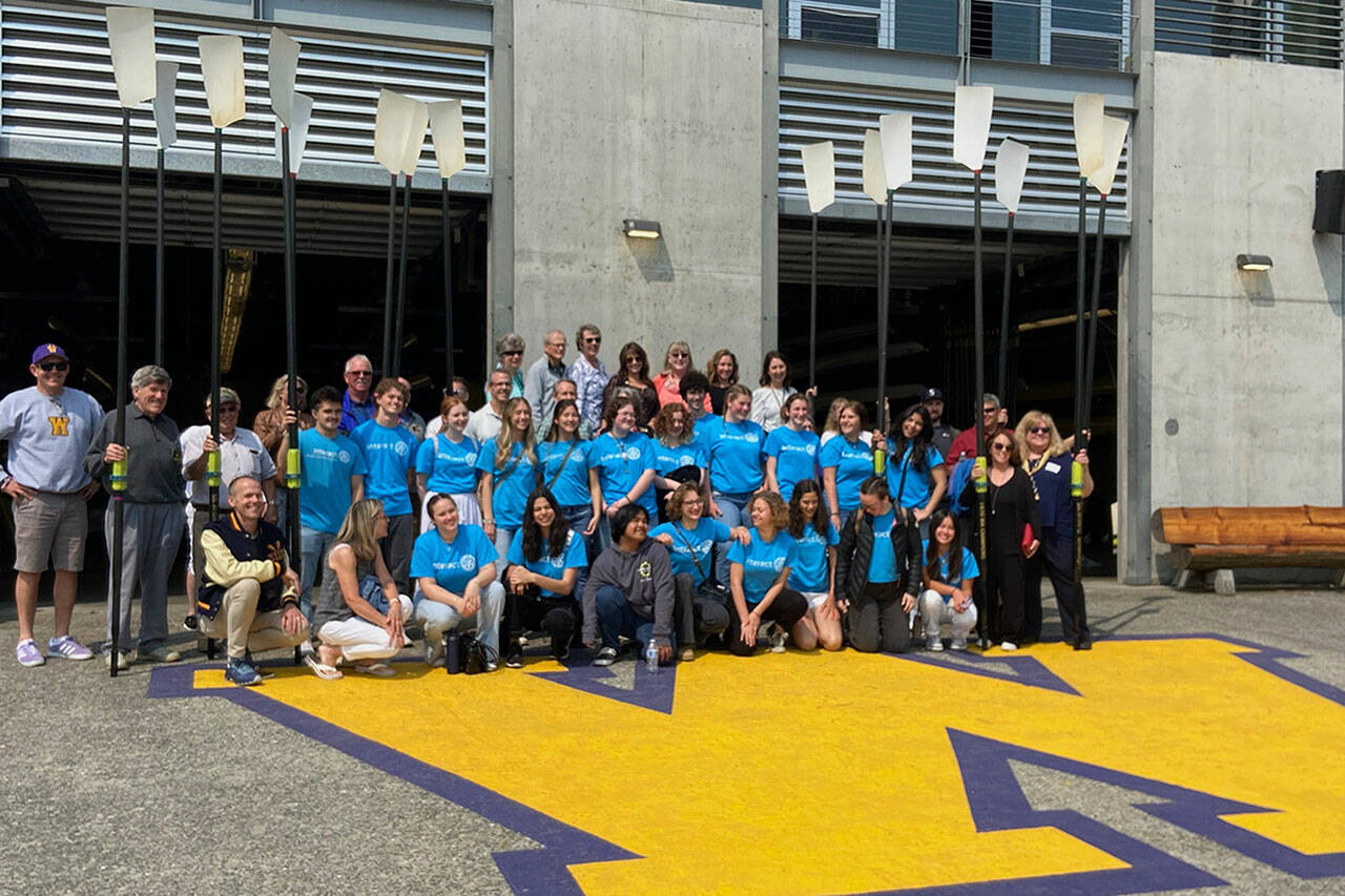 Photo courtesy Sequim Sunrise Rotary/ In May, 23 Sequim Interact Club members and 18 Rotarians visited Seattle to see the rowing facilities at the University of Washington, including the shell house where Joe Rantz trained and rowed. He and other rowers were profiled in the book The Boys in the Boat by Daniel James Brown and now a movie adaptation set for release on Christmas by George Clooney.