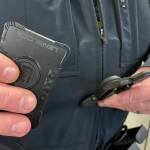 Sequim Gazette photo by Matthew Nash/ Sequim police officer Devin McBride uses a magnet in his uniform to attach his LensLock body-worn camera while on duty. He said he doesnt even notice it while working, and its easy to use.